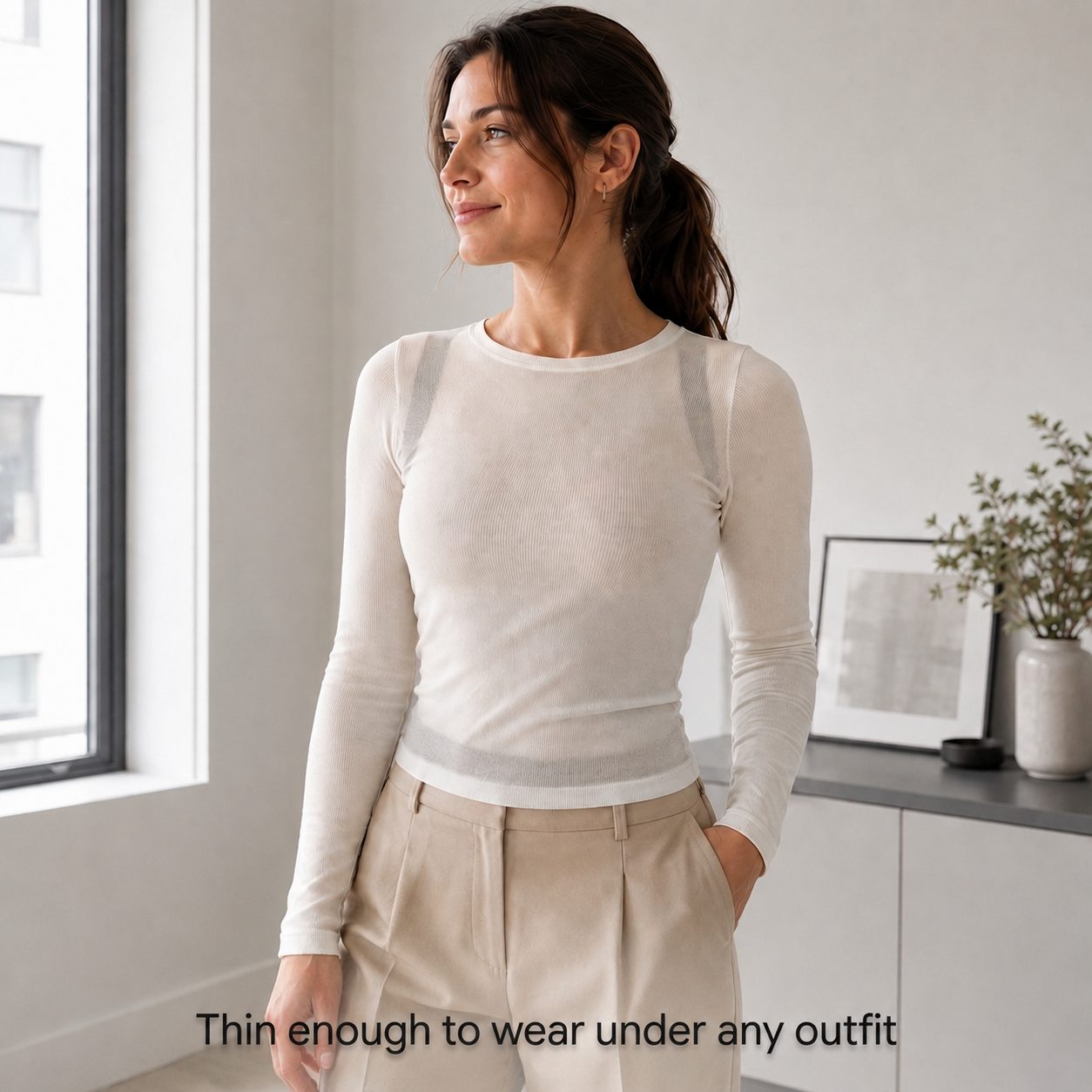Woman wearing VELTIS Posture Corrector Pro hidden discreetly under white top